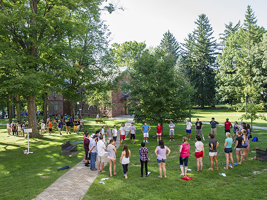 Large group of students standing in circle